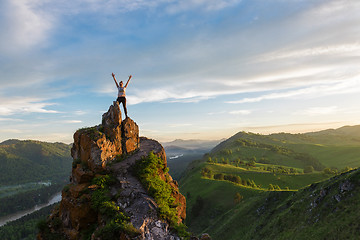 Image showing Happy woman on top mountain