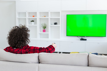 Image showing young man in bathrobe enjoying free time