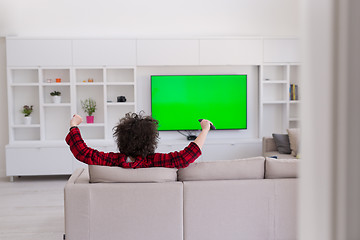 Image showing young man in bathrobe enjoying free time