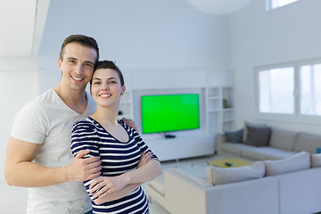 Image showing couple hugging in their new home