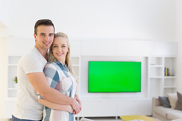 Image showing couple hugging in their new home