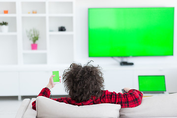 Image showing young man in bathrobe enjoying free time