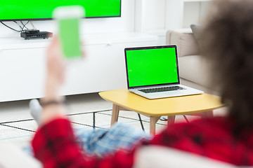 Image showing young man in bathrobe enjoying free time