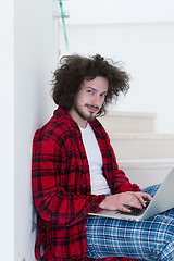 Image showing freelancer in bathrobe working from home