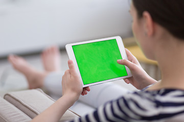 Image showing woman on sofa using tablet computer