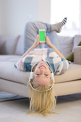 Image showing girl enjoying music through headphones