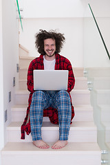 Image showing freelancer in bathrobe working from home