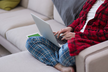 Image showing man freelancer in bathrobe working from home