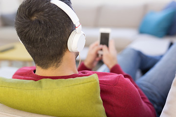 Image showing man enjoying music through headphones
