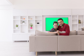 Image showing couple hugging and relaxing on sofa