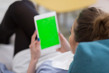 Image showing woman on sofa using tablet computer