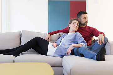 Image showing couple hugging and relaxing on sofa