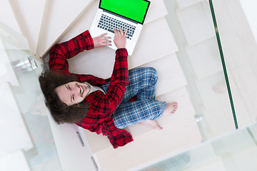 Image showing freelancer in bathrobe working from home