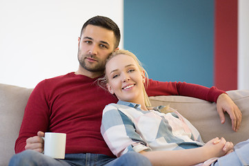 Image showing couple hugging and relaxing on sofa