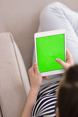 Image showing woman on sofa using tablet computer