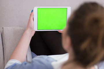Image showing woman on sofa using tablet computer