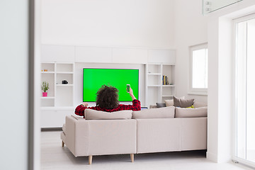 Image showing young man in bathrobe enjoying free time