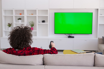 Image showing young man in bathrobe enjoying free time