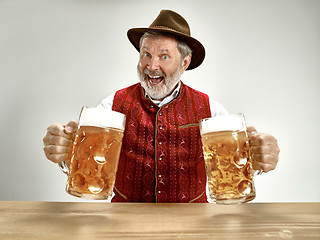 Image showing Germany, Bavaria, Upper Bavaria, man with beer dressed in traditional Austrian or Bavarian costume