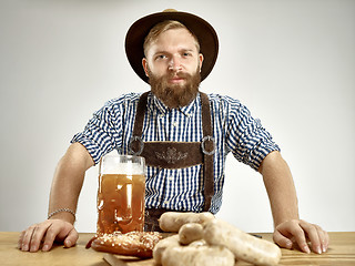 Image showing Germany, Bavaria, Upper Bavaria, man with beer dressed in traditional Austrian or Bavarian costume