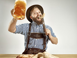 Image showing Germany, Bavaria, Upper Bavaria, man with beer dressed in traditional Austrian or Bavarian costume