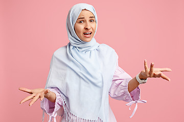 Image showing Argue, arguing concept. arab woman in hijab. Portrait of girl, posing at studio background