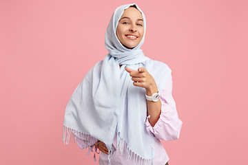 Image showing Happy arab woman in hijab. Portrait of smiling girl, posing at studio background