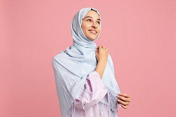 Image showing Happy arab woman in hijab. Portrait of smiling girl, posing at studio background