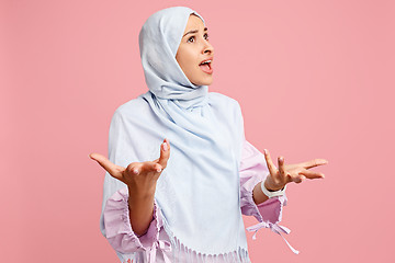 Image showing Argue, arguing concept. arab woman in hijab. Portrait of girl, posing at studio background