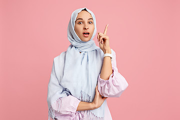 Image showing Happy arab woman in hijab. Portrait of smiling girl, posing at studio background