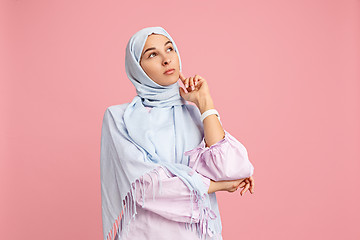 Image showing The arab woman in hijab. Portrait of serious girl, posing at studio background
