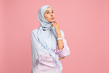 Image showing The arab woman in hijab. Portrait of serious girl, posing at studio background