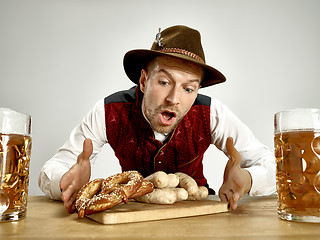 Image showing Germany, Bavaria, Upper Bavaria, man with beer dressed in traditional Austrian or Bavarian costume