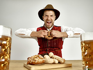 Image showing Germany, Bavaria, Upper Bavaria, man with beer dressed in traditional Austrian or Bavarian costume