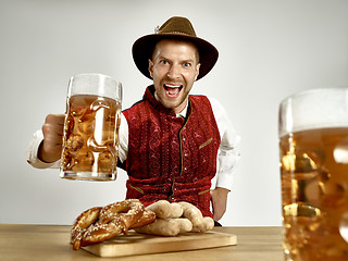 Image showing Germany, Bavaria, Upper Bavaria, man with beer dressed in traditional Austrian or Bavarian costume