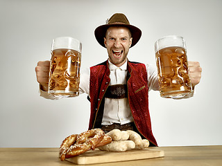 Image showing Germany, Bavaria, Upper Bavaria, man with beer dressed in traditional Austrian or Bavarian costume