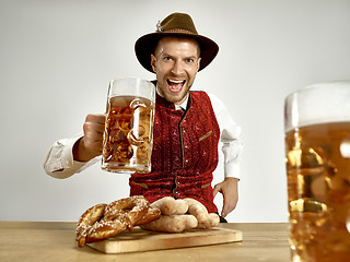 Image showing Germany, Bavaria, Upper Bavaria, man with beer dressed in traditional Austrian or Bavarian costume