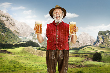 Image showing Germany, Bavaria, Upper Bavaria, man with beer dressed in traditional Austrian or Bavarian costume