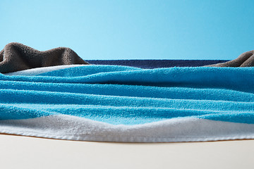 Image showing Seascape with waves and rocks from colorful terry towels.