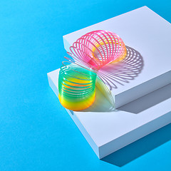 Image showing Classical slinky spring toy walking down the strairs.