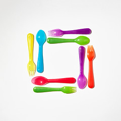 Image showing Square from colorful plastic cutlery on a light background.