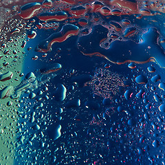 Image showing Close up water drops in ultravioler lighting.