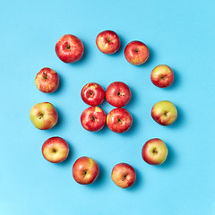 Image showing Round apples frame on a blue background.