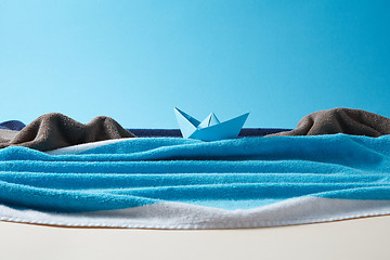 Image showing Seashore made from colored terry towels on doutone paper background.