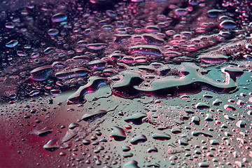 Image showing Abstract close-up water background with neon lights.