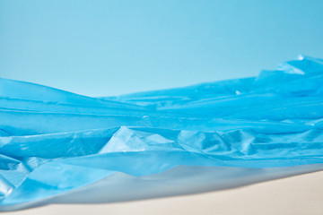 Image showing Blue plastic garbage bag as a seascape background.