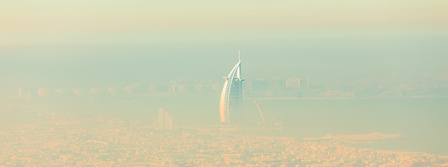 Image showing Skyline of Dubai beachfront with Burj Al Arab hotel on Jumeirah beach seen from Burj Khalifa viewpoint.