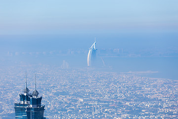 Image showing Skyline of Dubai beachfront with Burj Al Arab hotel on Jumeirah beach seen from Burj Khalifa viewpoint.