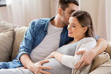 Image showing man hugging pregnant woman at home