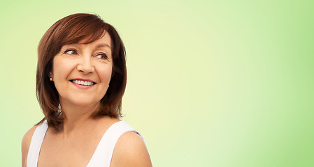 Image showing portrait of smiling senior woman over white